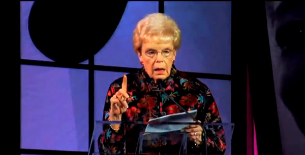 A friend of the couple who founded Home Instead Senior Care, Mary Maxwell was asked to give the invocation at the company's 2009 Convention. Initially it seemed like a normal prayer, but it soon took a very funny turn. Her deadpan delivery and lines like ...This is the first time I've ever been old... and it just sort of crept up on me ... had everyone rolling in the aisles.   