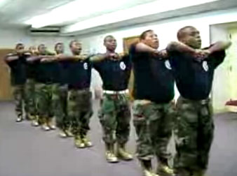 Teen boys in uniform drill, shout, profess, 'Yes we can'