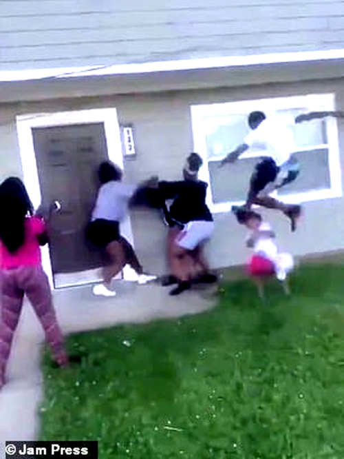 "Footage of the confrontation emerged on Twitter and shows three female teens attacking a black woman wearing a black and white hoodie as she stood outside a home with her toddler daughter.  The three girls are seen punching her body, pushing her onto the ground and  viciously pulling her hair. A male jumps into the fight and when he lands he kicks a toddler in the head, sending her spiraling towards the ground." - Daily Mail