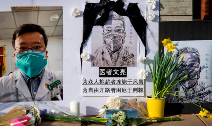 "Chinese students and their supporters hold a memorial for Dr Li Wenliang, who was the whistleblower of the CCP Virus that originated in Wuhan, China and caused the doctors death in that city, outside the UCLA campus in Westwood, California, on Feb. 15, 2020. (Mark Ralston/AFP via Getty Images)" - Epoch Times Magazine, April 2020 