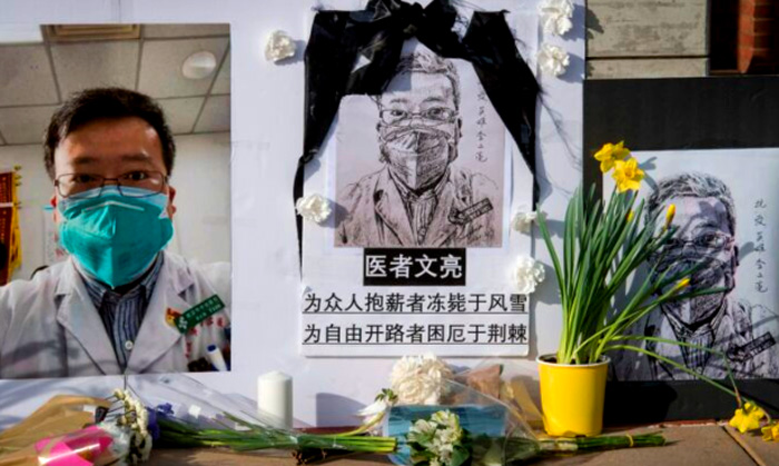 "Chinese students and their supporters hold a memorial for Dr Li Wenliang, who was the whistleblower of the CCP Virus that originated in Wuhan, China and caused the doctors death in that city, outside the UCLA campus in Westwood, California, on Feb. 15, 2020. (Mark Ralston/AFP via Getty Images)" - Epoch Times Magazine, April 2020