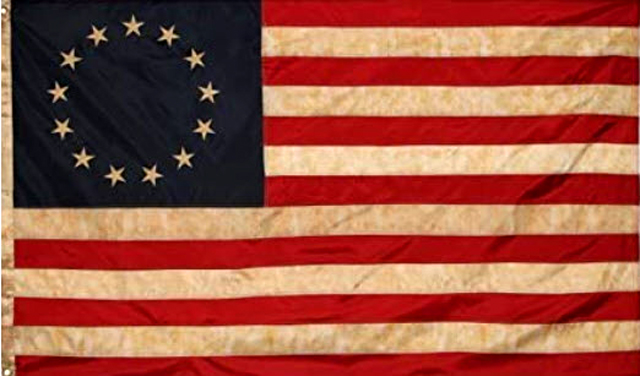 These Betsy Ross Flags are stained to look old and are thick, holding their own in the wind. I know, I have one in front of my home. - Webmaster