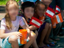 The cups were given to children by The Home Depot gay parade marchers, while homosexual activists followed up by introducing them to gay sex websites.  