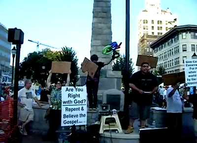 Screaming Christian preachers, Wiccans, Atheists, Meditators, and a panhandling Jesus all compete for attention in Pack Square during Bele Chere in Asheville, NC. 7/29/2011 Video by Chuck Allen. 